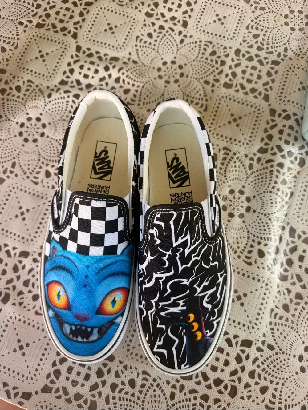 Vans Kids Slip-On Sneakers in Black, White & Blue with Graphic